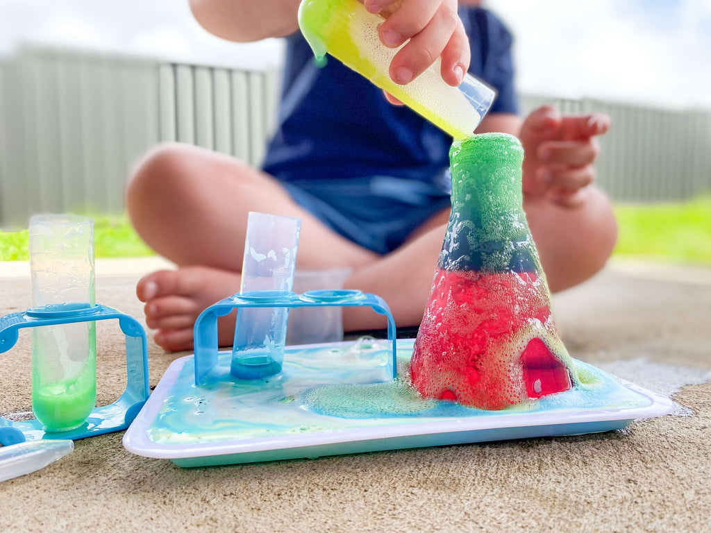 child playing with science kit for kids